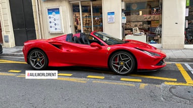 red convertible ferrari f8 spider parked in nice old town